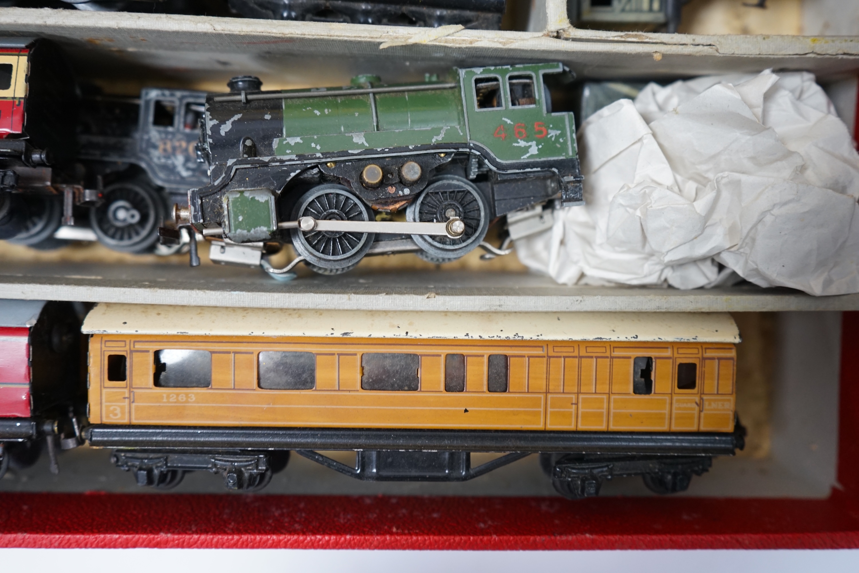 A Trix Twin Railway 00 gauge train set box containing; four locomotives, eight bogie coaches, two railcars, and six freight wagons, together with a live steam Marklin 0-4-0T LNER locomotive. Condition - poor to fair.